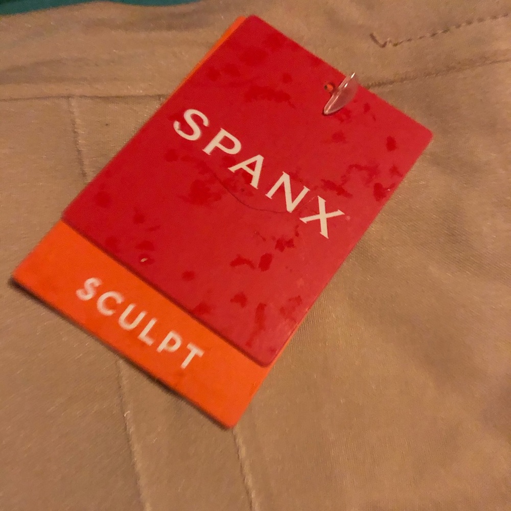 NWT spank that goes down to thighs. Size medium